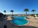 Stunning oceanfront pool with palm trees offering relaxation and luxury in a picturesque beachfront setting at 1540 Gulf Blvd # 2107, Clearwater Beach, FL 33767