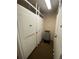 Indoor storage area with multiple tall white lockers at 1540 Gulf Blvd # 2107, Clearwater Beach, FL 33767