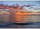 Beautiful ocean sunset view displaying orange and pink clouds reflecting on the serene water at 1540 Gulf Blvd # 2107, Clearwater Beach, FL 33767