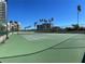 Well-maintained tennis court with palm trees in the background at 1540 Gulf Blvd # 2107, Clearwater Beach, FL 33767