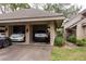 Three-car garage featuring covered parking and extra storage at 102 Old Mill Pond Rd, Palm Harbor, FL 34683