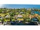 Aerial view of waterfront home with private dock at 152 Carlyle Dr, Palm Harbor, FL 34683