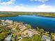 Aerial view of waterfront home and neighborhood, showcasing canal access at 152 Carlyle Dr, Palm Harbor, FL 34683