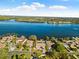 Aerial view highlighting waterfront home's location and canal access at 152 Carlyle Dr, Palm Harbor, FL 34683