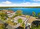 Aerial view of waterfront home and neighborhood at 152 Carlyle Dr, Palm Harbor, FL 34683