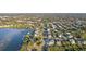 Wide aerial view of waterfront community and surrounding landscape at 152 Carlyle Dr, Palm Harbor, FL 34683