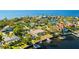 Aerial view of waterfront home and neighborhood at 152 Carlyle Dr, Palm Harbor, FL 34683