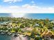 Aerial view of waterfront community with lush landscaping at 152 Carlyle Dr, Palm Harbor, FL 34683