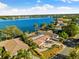 Wide aerial view of waterfront home and surrounding neighborhood at 152 Carlyle Dr, Palm Harbor, FL 34683