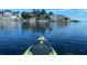 Kayaking view of waterfront homes on a sunny day at 152 Carlyle Dr, Palm Harbor, FL 34683