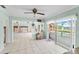 Kitchen with water views and sliding glass doors. Needs updating at 152 Carlyle Dr, Palm Harbor, FL 34683