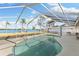 Screened pool with patio furniture and water views at 152 Carlyle Dr, Palm Harbor, FL 34683