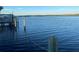 Scenic waterfront view with a calm blue water and a clear sky at 152 Carlyle Dr, Palm Harbor, FL 34683