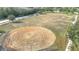 Aerial view of a large, open park area with a circular feature at 18518 Avocet Dr, Lutz, FL 33558