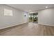 Living area with sliding doors leading to a screened patio at 3457 Timber Crossing Ave, Brandon, FL 33511