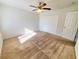 Spacious bedroom with carpeted floors and double doors at 4027 Harbor Lake Dr, Lutz, FL 33558