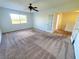 Bright bedroom with carpeted floors and French doors at 4027 Harbor Lake Dr, Lutz, FL 33558