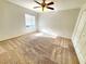 Well-lit bedroom featuring carpeted floors at 4027 Harbor Lake Dr, Lutz, FL 33558