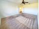 Bright bedroom with carpeted floors and French doors at 4027 Harbor Lake Dr, Lutz, FL 33558