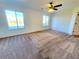 Spacious bedroom with carpet and large windows at 4027 Harbor Lake Dr, Lutz, FL 33558