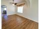 Open dining room with wood-look floors and kitchen views at 4027 Harbor Lake Dr, Lutz, FL 33558