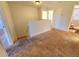 Upstairs hallway with carpet and access to bedrooms at 4027 Harbor Lake Dr, Lutz, FL 33558