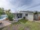 Brick paved pathway leads to a screened patio and pool at 4608 S Shamrock Rd, Tampa, FL 33611