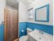 Simple bathroom with shower, toilet, and white vanity at 4608 S Shamrock Rd, Tampa, FL 33611