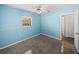 Light blue bedroom with carpet, window and closet at 4608 S Shamrock Rd, Tampa, FL 33611