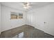 Bright bedroom with window, ceiling fan, and closet at 4608 S Shamrock Rd, Tampa, FL 33611