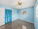 Light blue bedroom with carpeting, built-in closet, and window at 4608 S Shamrock Rd, Tampa, FL 33611