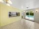 Dining room with view of pool and pass-through to kitchen at 4608 S Shamrock Rd, Tampa, FL 33611