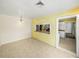 Bright dining room with tile flooring and a pass-through to kitchen at 4608 S Shamrock Rd, Tampa, FL 33611