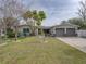 Updated single-story home with a two-car garage and nicely landscaped lawn at 4608 S Shamrock Rd, Tampa, FL 33611