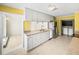 This kitchen boasts ample counter space and white cabinetry at 4608 S Shamrock Rd, Tampa, FL 33611