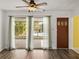 Living room with sliding doors to a screened patio and pool at 4608 S Shamrock Rd, Tampa, FL 33611