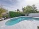 Serene kidney-shaped pool, surrounded by greenery at 4608 S Shamrock Rd, Tampa, FL 33611