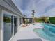 Refreshing kidney-shaped pool and patio with sliding glass doors at 4608 S Shamrock Rd, Tampa, FL 33611