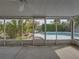 Screened patio overlooking the pool area, with ceiling fan at 4608 S Shamrock Rd, Tampa, FL 33611