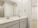 Double vanity bathroom with gray cabinets and quartz countertop at 6173 Timberdale Ave, Wesley Chapel, FL 33545