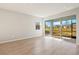 Living room with sliding glass doors opening to backyard at 6173 Timberdale Ave, Wesley Chapel, FL 33545