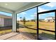 Screened porch overlooking backyard and neighborhood at 6173 Timberdale Ave, Wesley Chapel, FL 33545