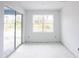 Unfurnished bedroom with tile floors and sliding glass door at 9024 Evelyn Rd, Englewood, FL 34224