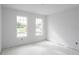 Spacious bedroom with large windows and tile floors at 9024 Evelyn Rd, Englewood, FL 34224