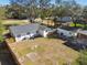 Aerial view of a home with a detached garage and large backyard at 12308 N 53Rd St, Temple Terrace, FL 33617