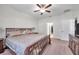 Spacious main bedroom with king-size bed, dresser, and large windows at 21489 Billowy Jaunt Dr, Land O Lakes, FL 34637