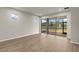 Bright living room with sliding glass doors leading to a screened patio at 6162 Timberdale Ave, Wesley Chapel, FL 33545