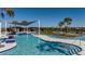 Resort-style pool with expansive deck and shaded areas at 6162 Timberdale Ave, Wesley Chapel, FL 33545