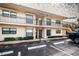 Two-story building with four units, balconies, and parking at 6180 Sun Blvd # 204, St Petersburg, FL 33715