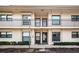 Two-story building with four units, balconies, and parking at 6180 Sun Blvd # 204, St Petersburg, FL 33715